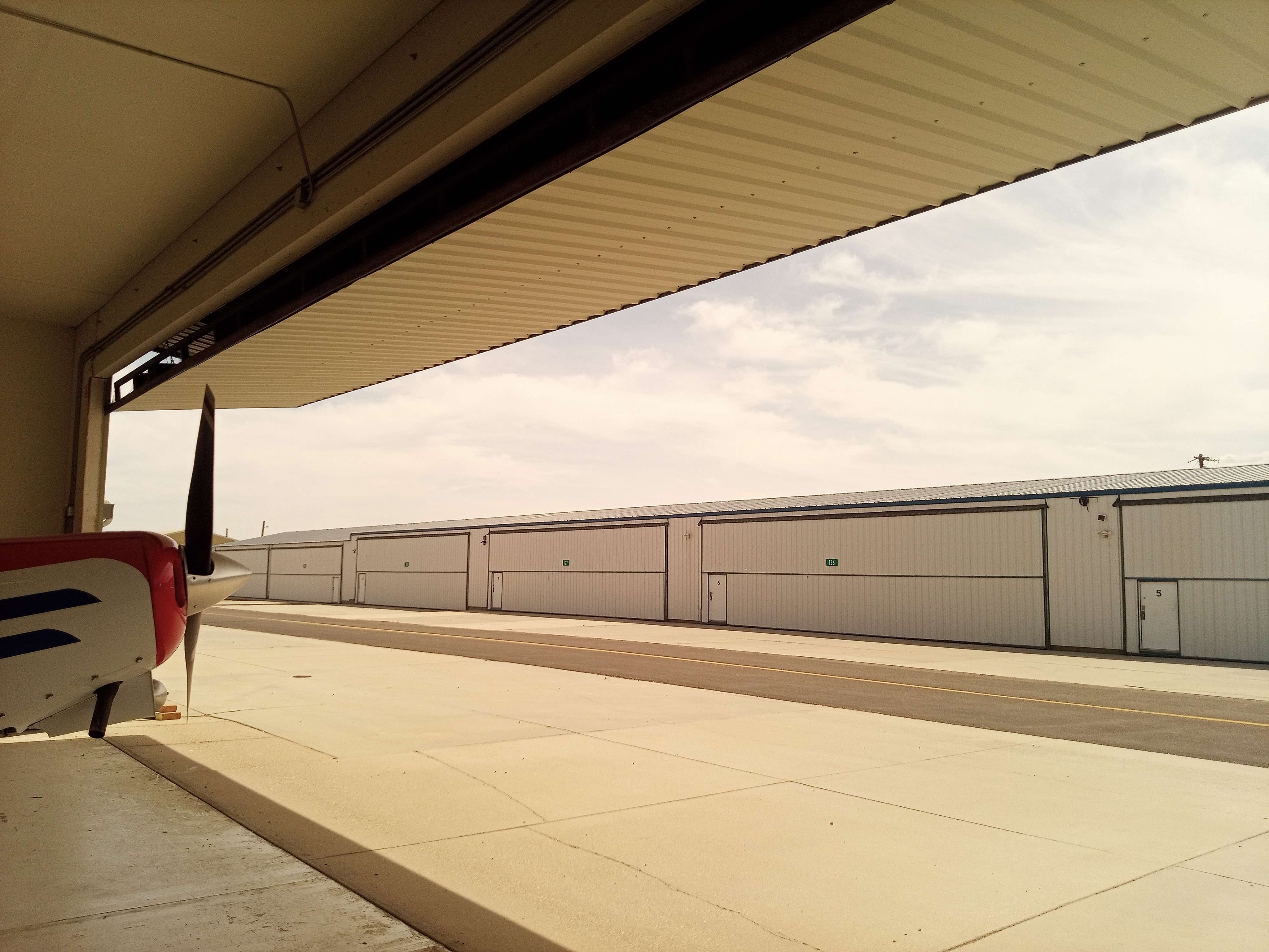 Hangar_115_-_3._Inside_looking_out_open_bifold_door.jpg