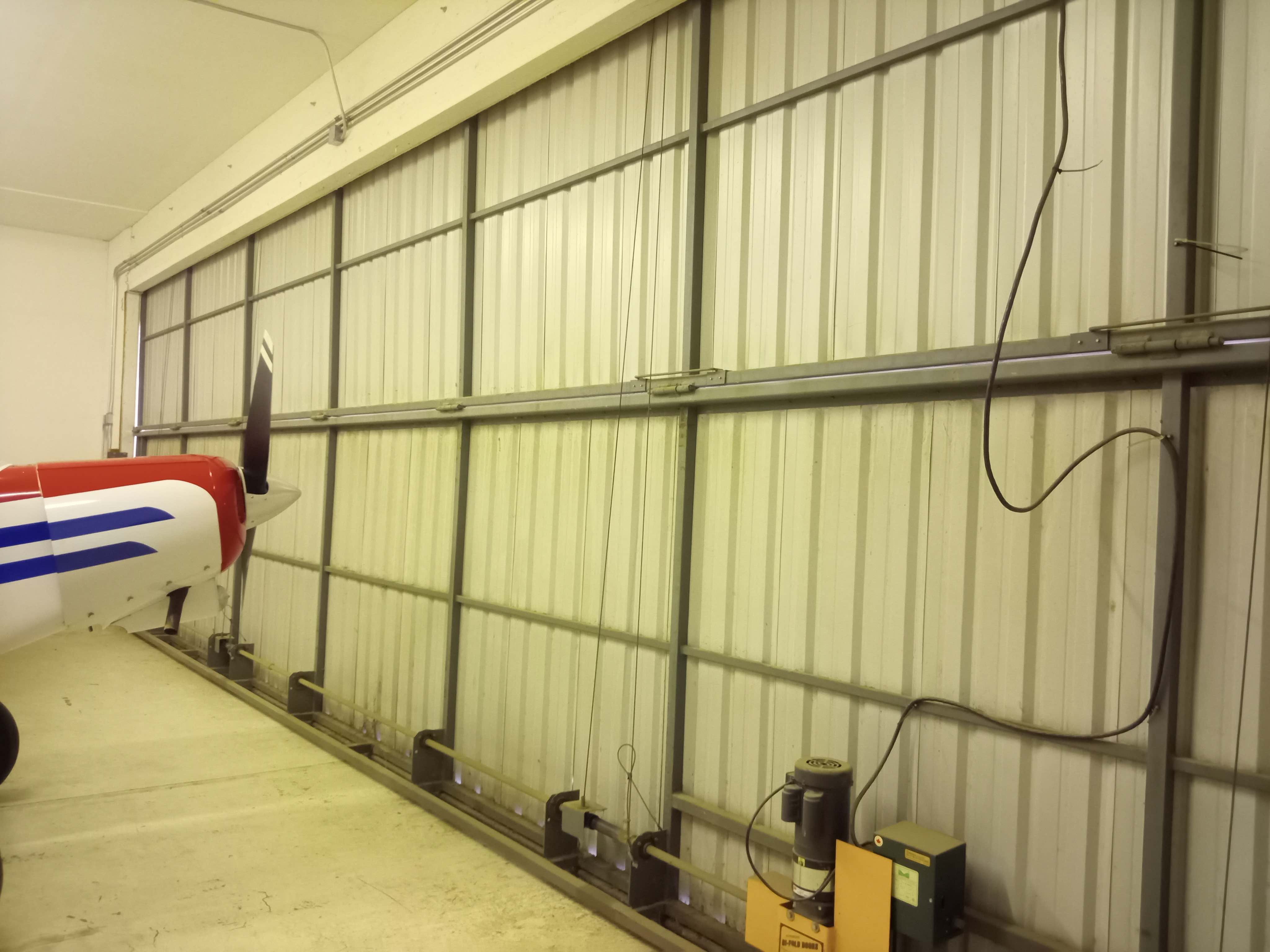 Hangar_115_-_6._inside_Schweiss_bifold_door_looking_east.jpg